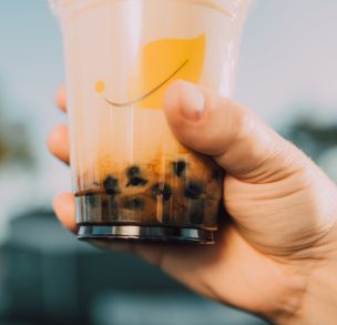 a Close Up Shot of a Person Holding a Milk Tea